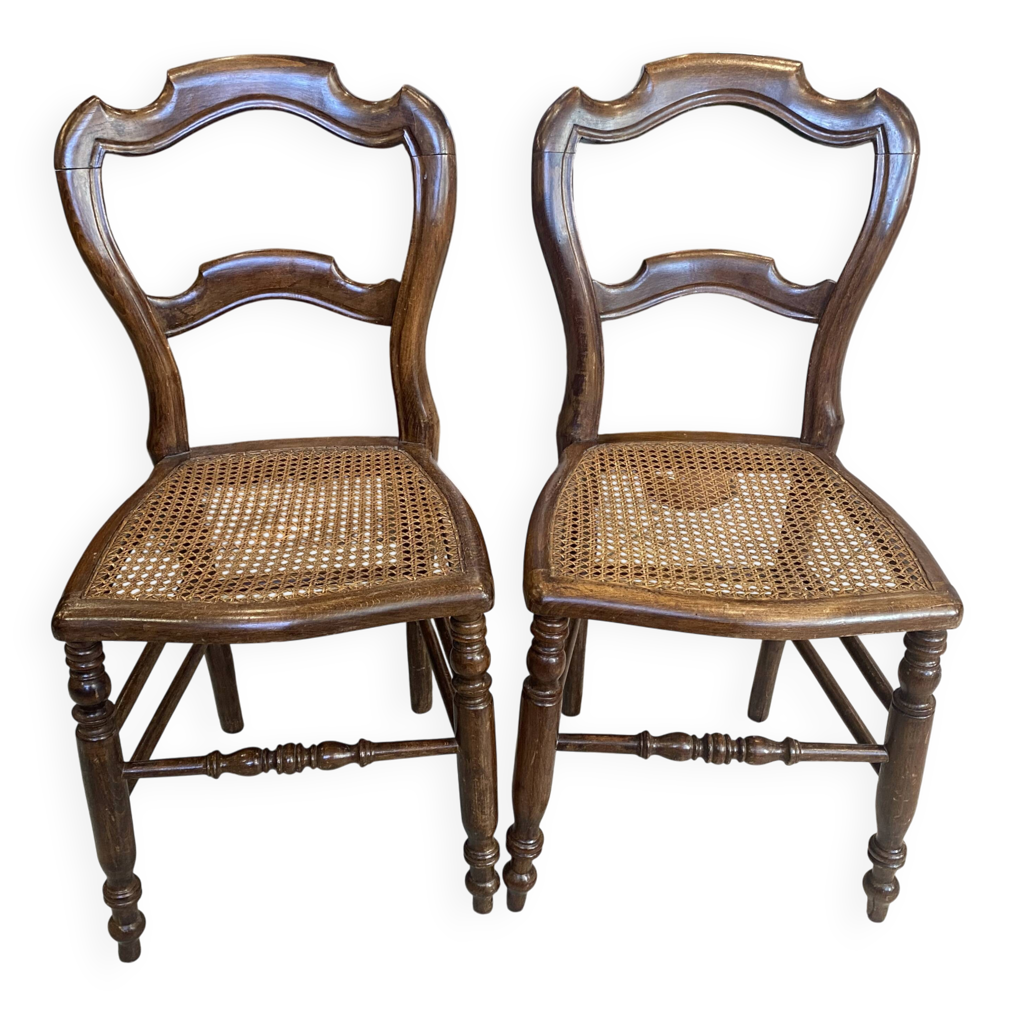 Pair of N2 antique caned and wooden chairs from the 1900s.