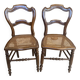 Pair of N2 antique caned and wooden chairs from the 1900s.