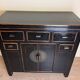 Chinese chest of drawers in black and gold lacquer