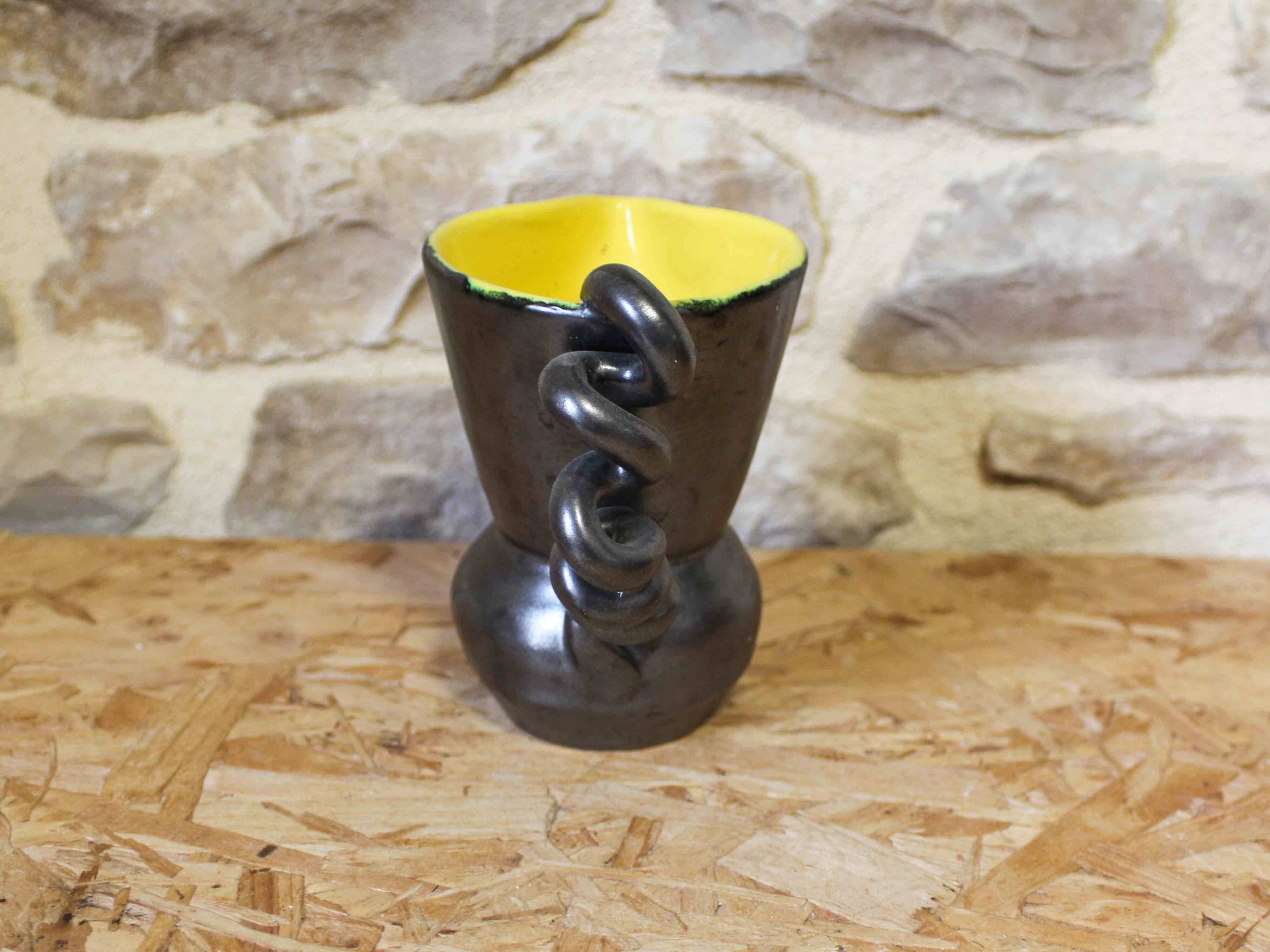 Ceramic jug with a twisted handle