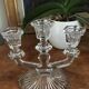 Three-pointed glass candlestick