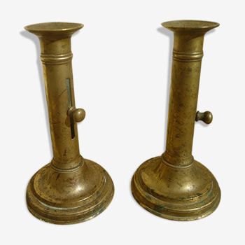 Pair of candlesticks a push brass