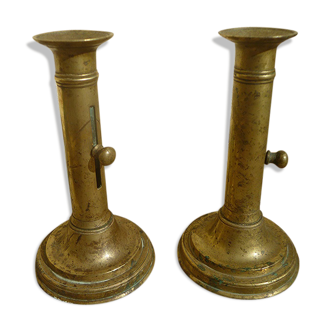 Pair of candlesticks a push brass