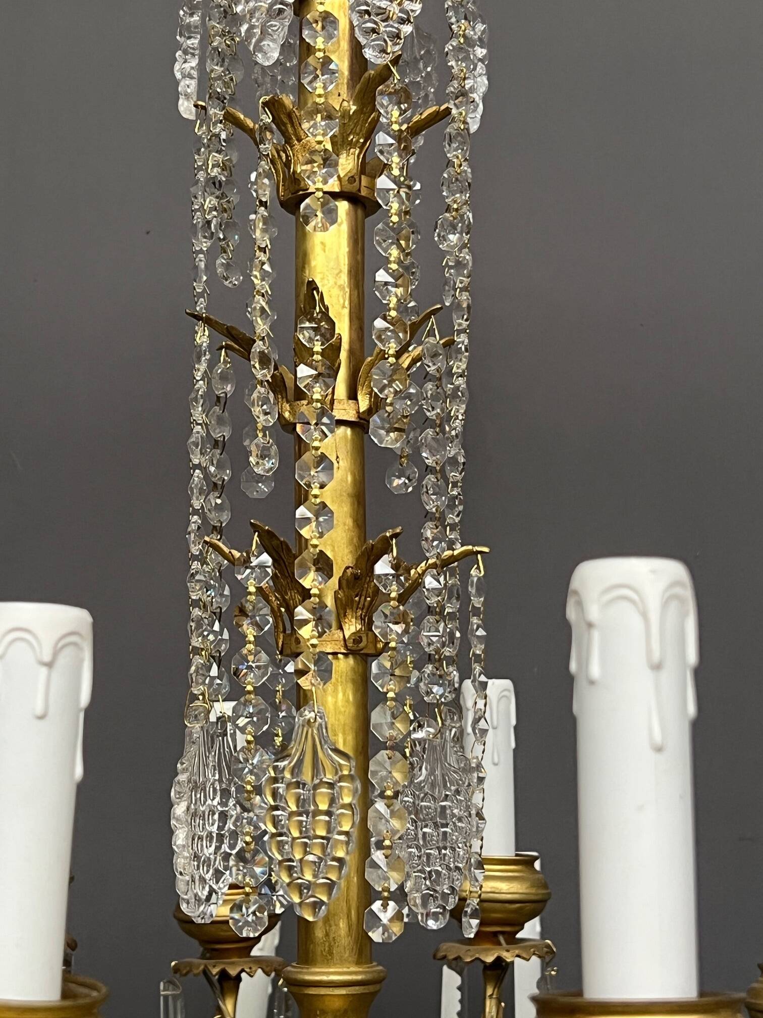 Antique chandelier with 24 light points. Bronze, solid crystal.