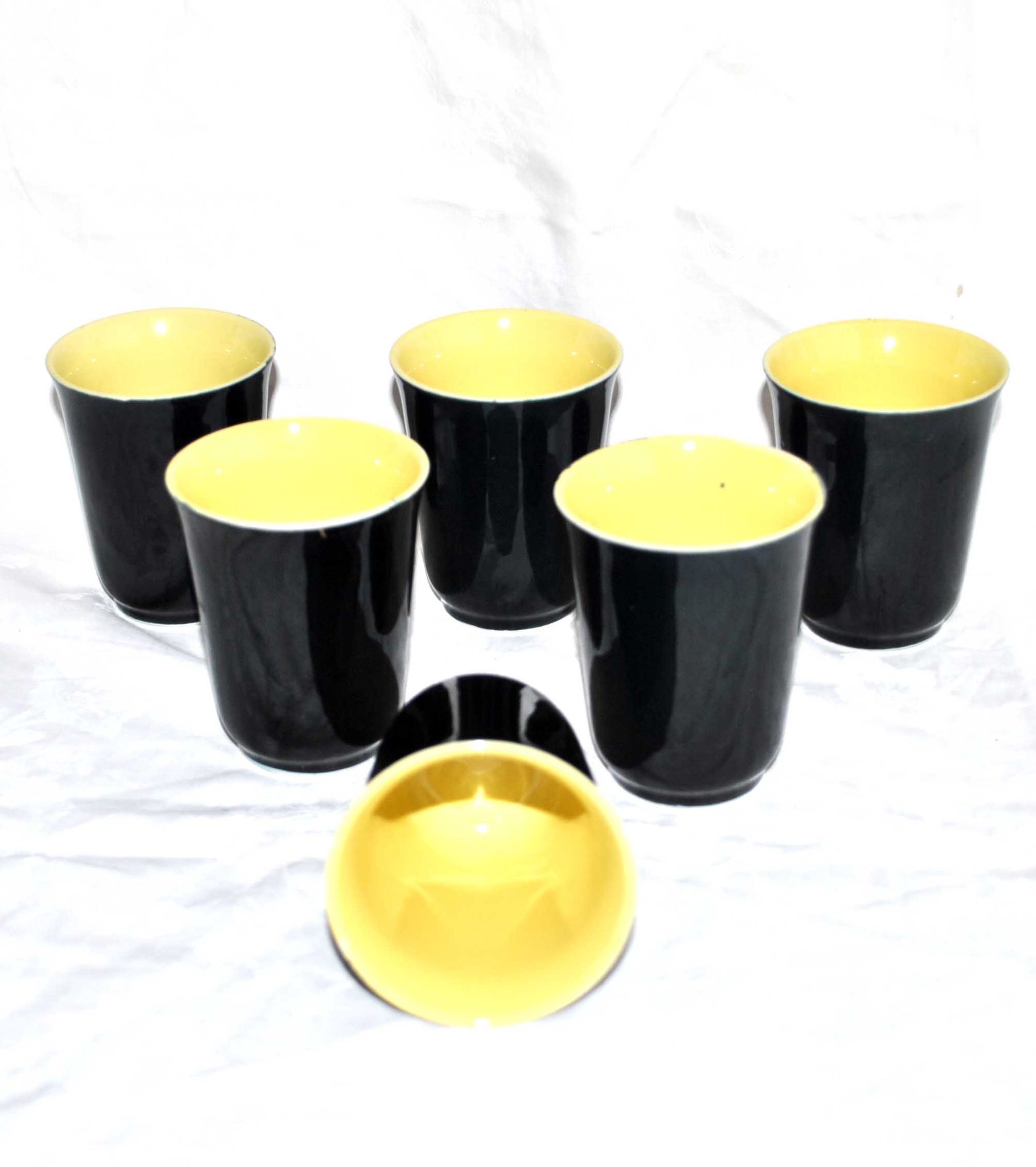 12 glasses in black and yellow ceramic