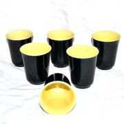 12 glasses in black and yellow ceramic