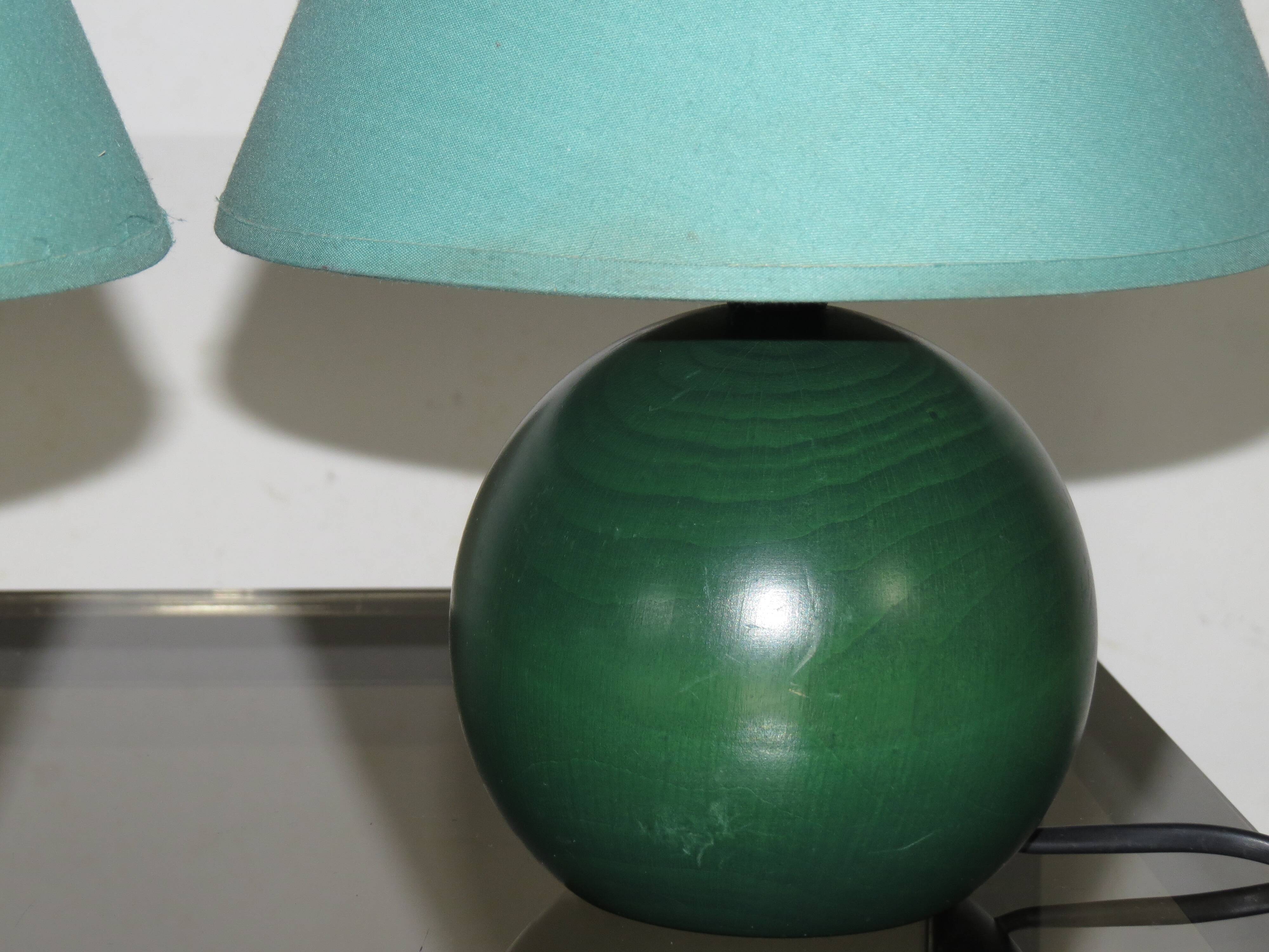 Pair of small green wooden ball lamps