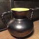 Iridescent black and yellow ceramic vase
