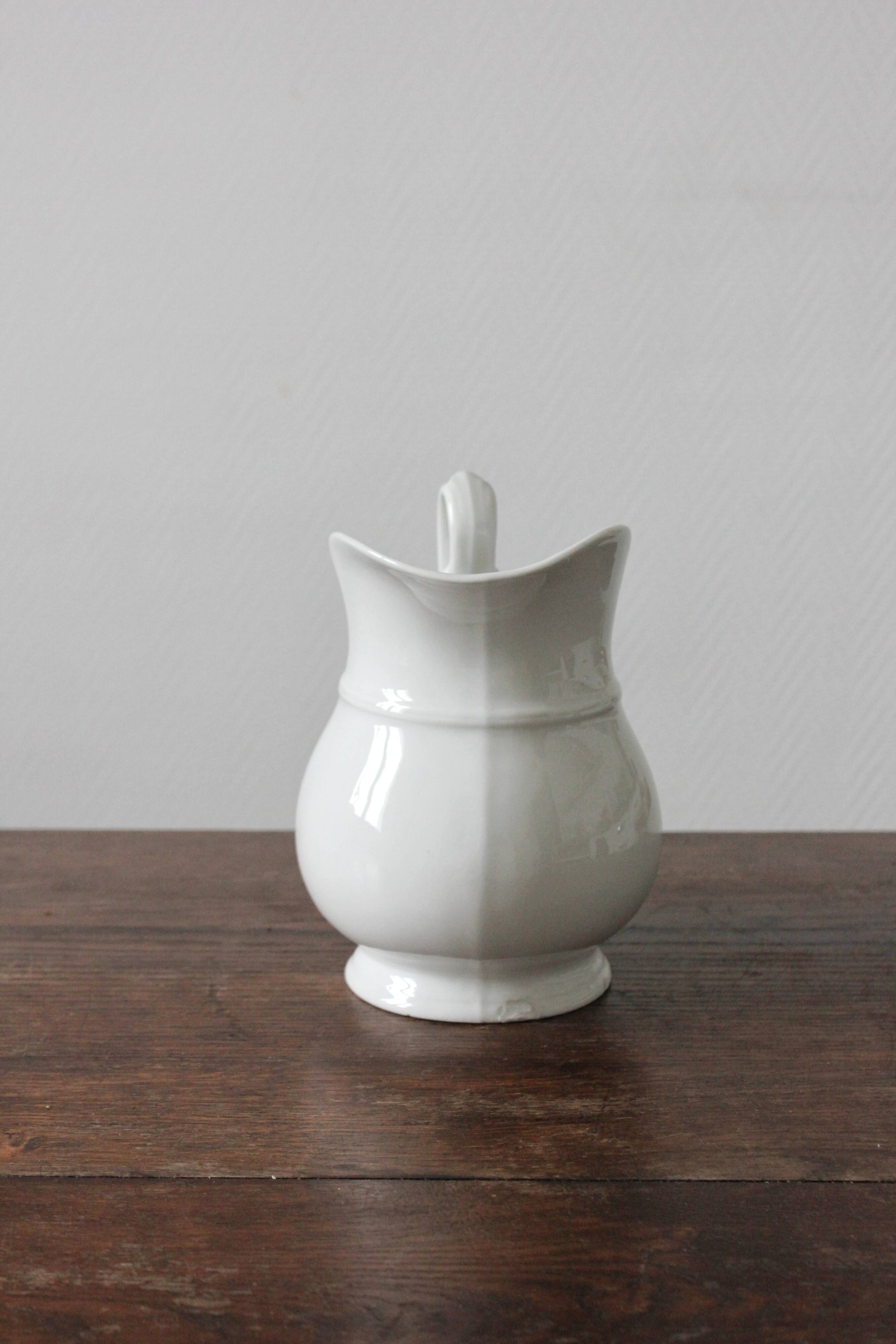 Old broc in white earthenware