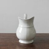 Old broc in white earthenware