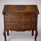 Antique solid wood secretary richly carved, in the Louis XV style.