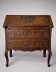 Antique solid wood secretary richly carved, in the Louis XV style.
