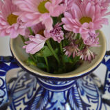 White hand-painted ceramic vase with blue patterns