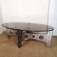 Table basse design vintage en alu brossé et plateau de verre.