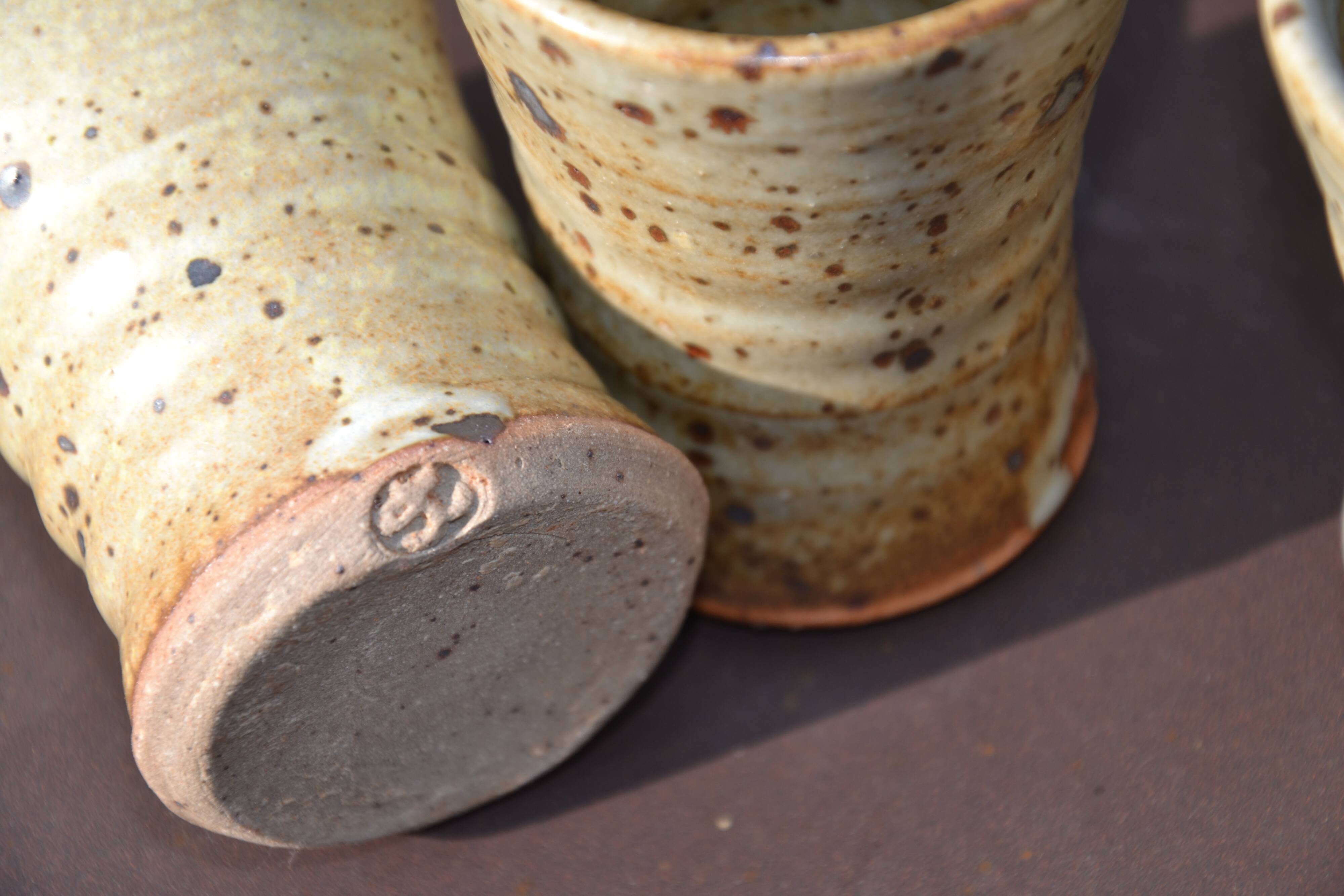 8 stoneware cups/mugs by Gustave Tiffoche