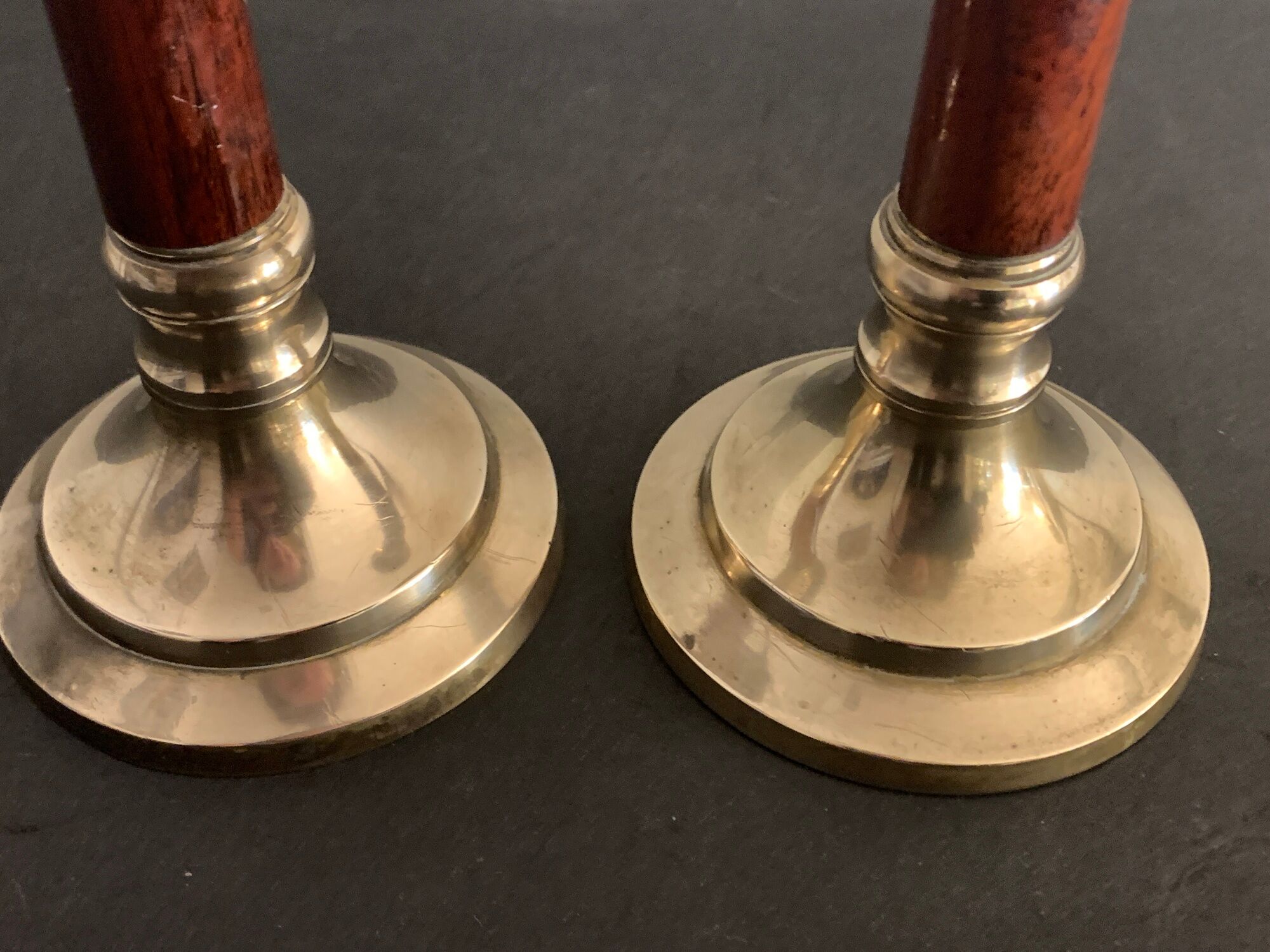 Pair of brass and mahogany wood candle holders
