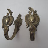 Pair of embraces in brass or bronze