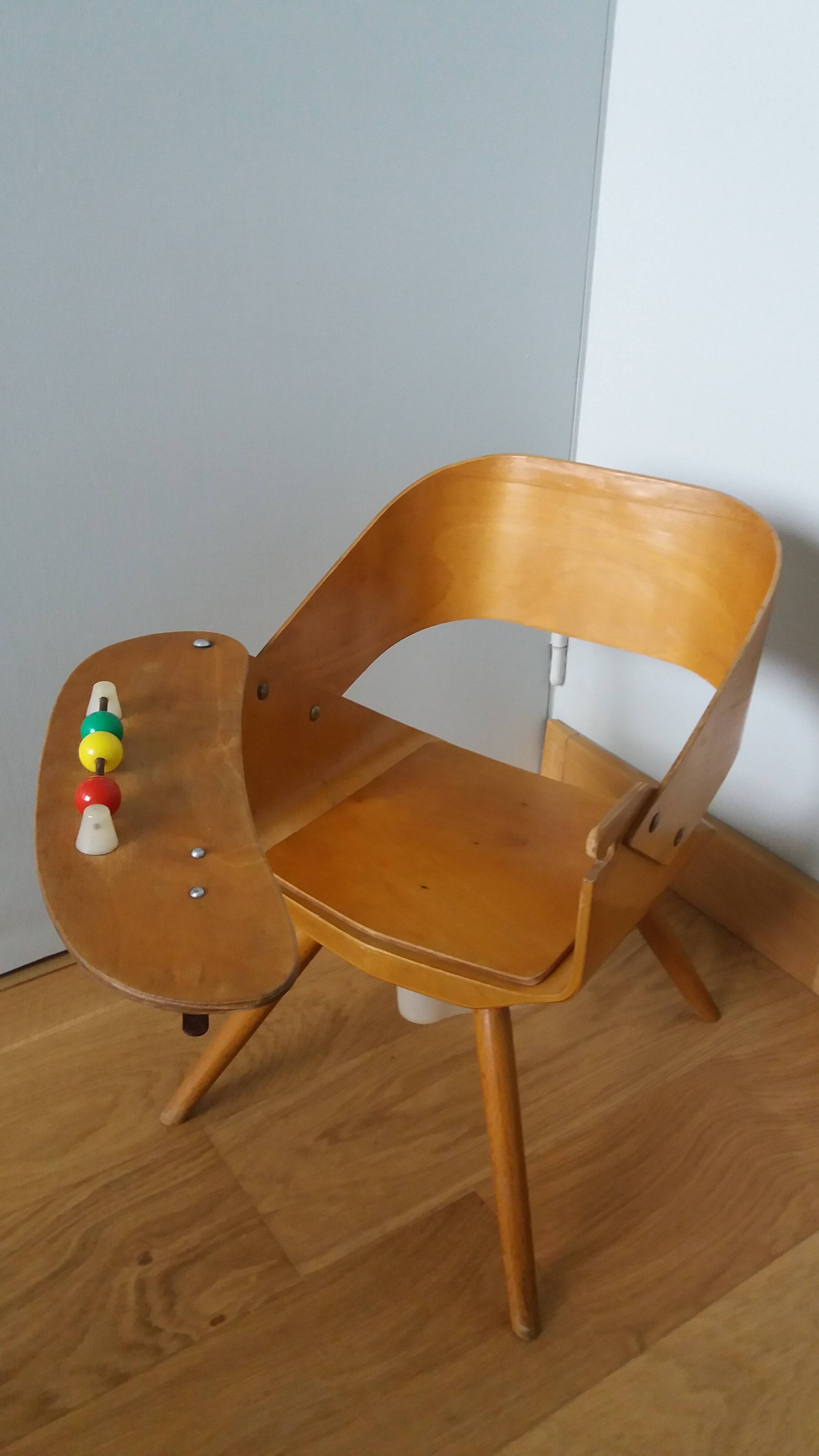 Baumann Baby Coquille children's armchair in bent wood with splayed legs.