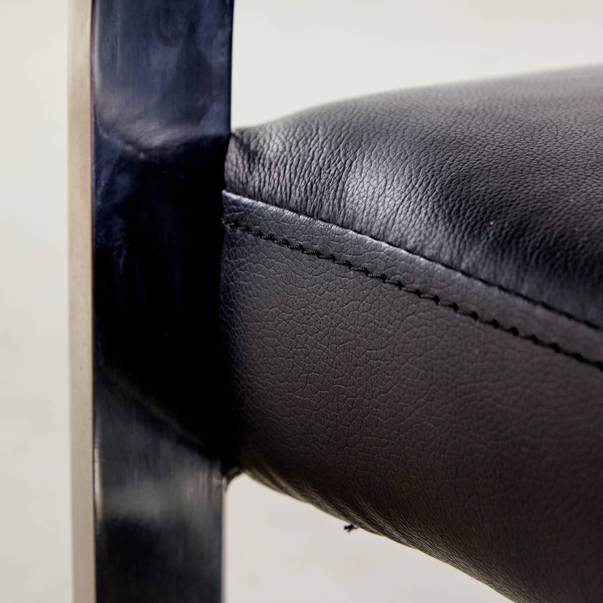 Steel armchair with leather upholstery