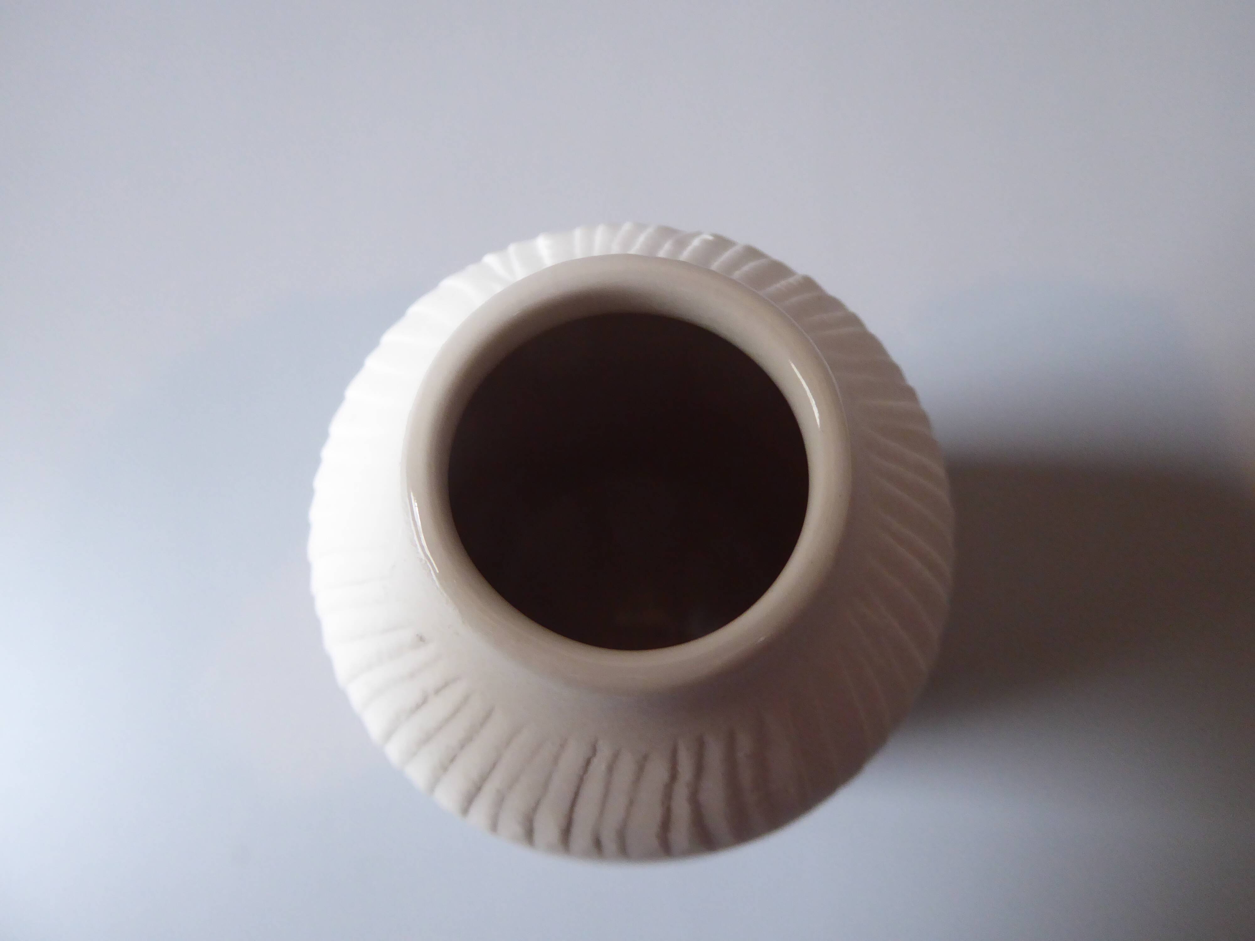 Porcelain vase and biscuit decorated with flowers