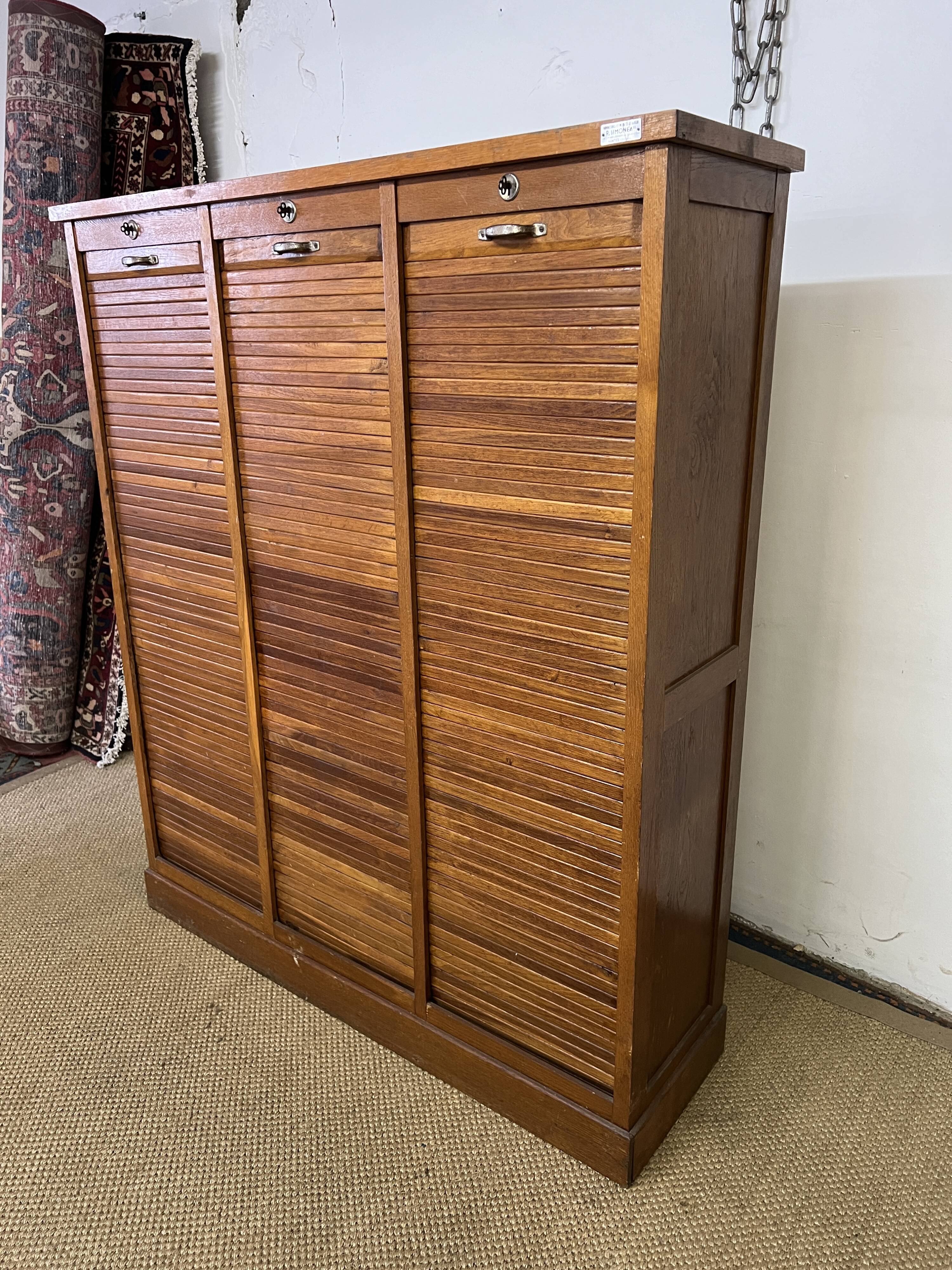 Old filing cabinet with triple curtains
