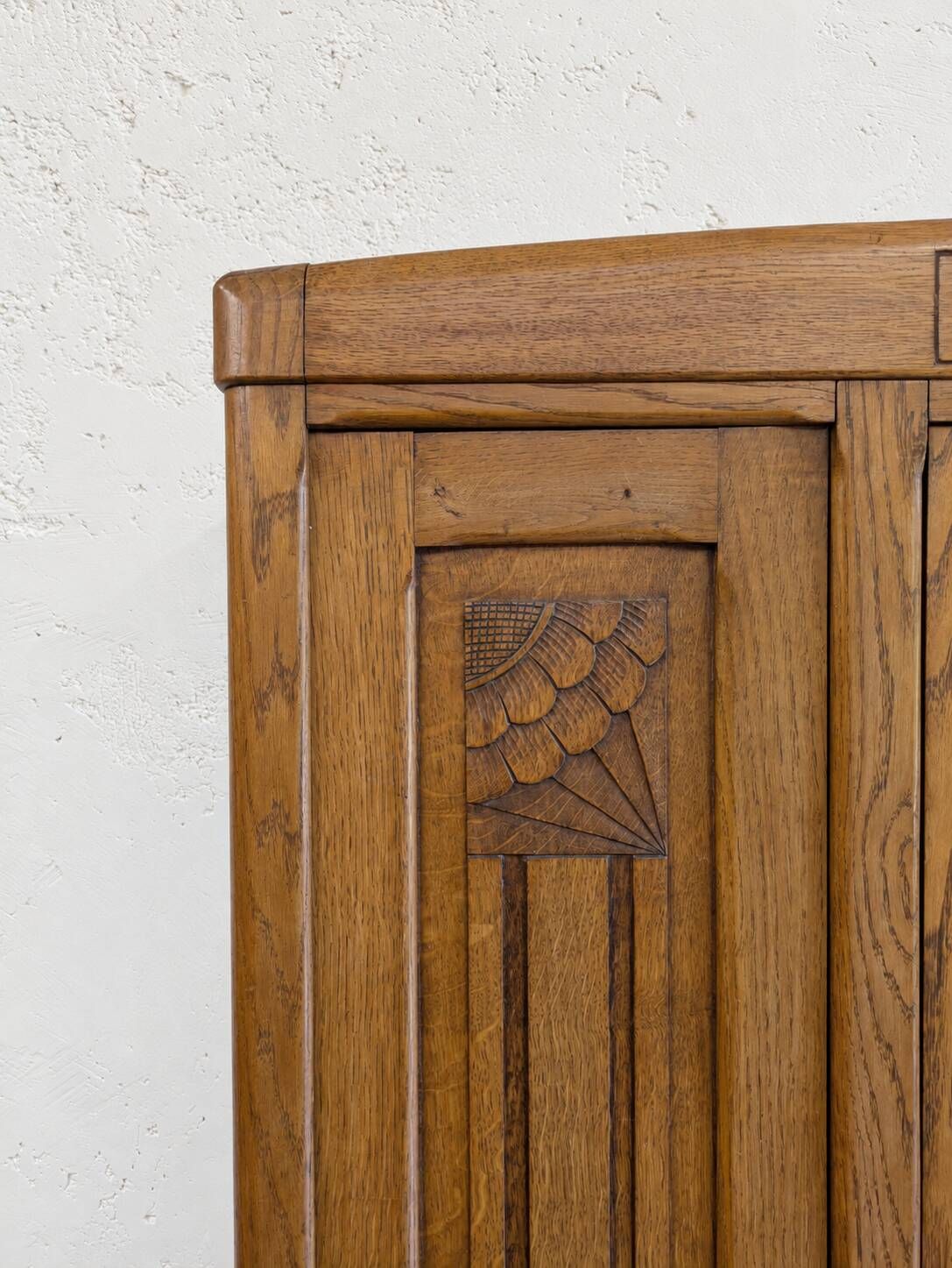 Art Deco oak wardrobe with three doors and bevelled mirror.
