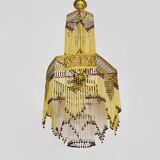 Art Nouveau style bronze chandelier with yellow and mauve pendants, 11 lights. 1960s