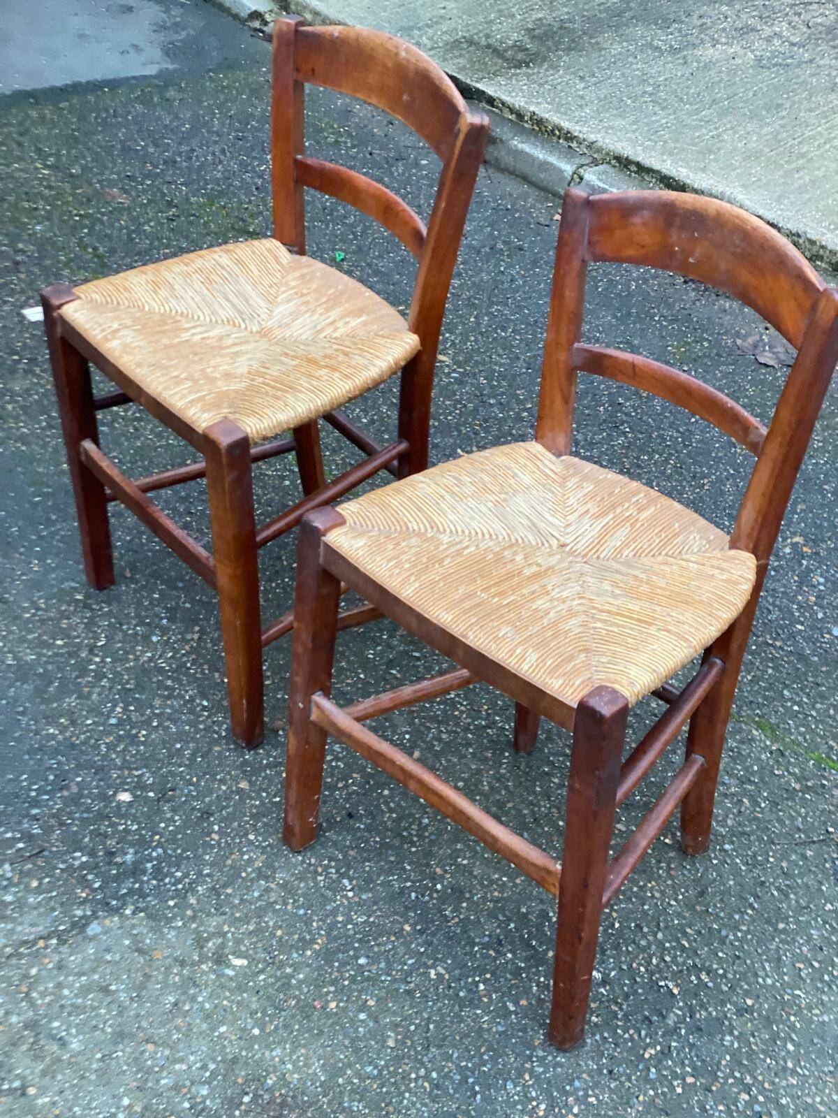 2 solid wood chairs with rush seats, child size.