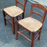 2 solid wood chairs with rush seats, child size.