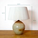 Large stone lamp with a cotton shade.