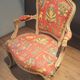 Louis XV style armchair upholstered with an Egyptian pattern.