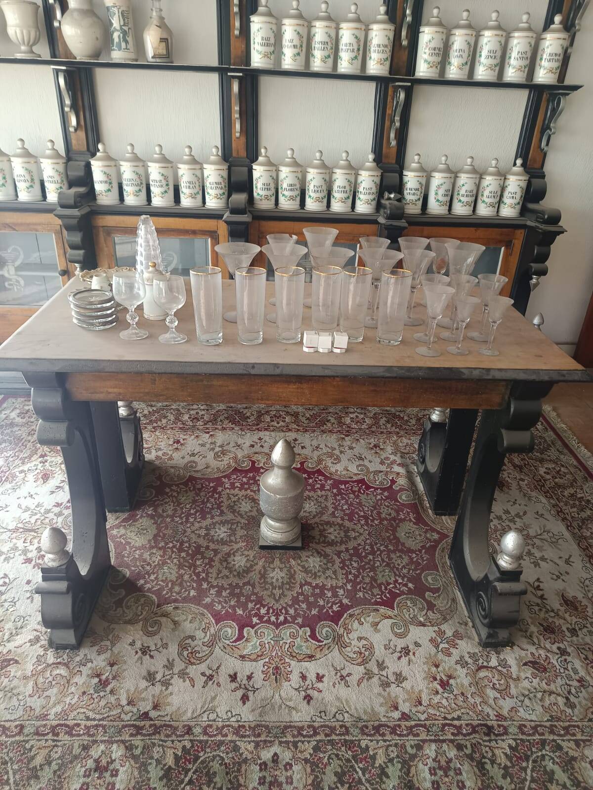 Antique Spanish pharmacy shelves and apothecary table (late 19th c.)