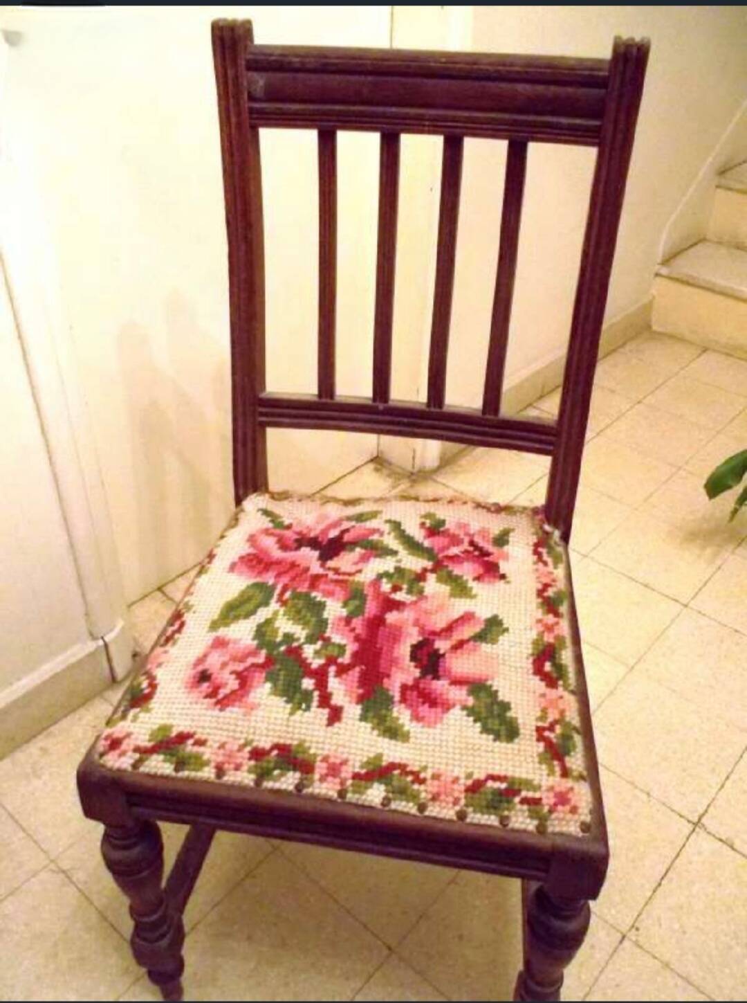 Wooden chair with embroidered seat