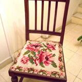 Wooden chair with embroidered seat