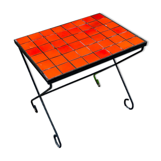 Orange tiled pedestal table