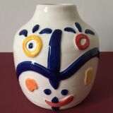 White porcelain vase created by Juan di Novita. Hand painted designs.