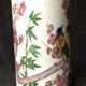 Small vase roll decoration birds branches of cherry blossoms and flowers