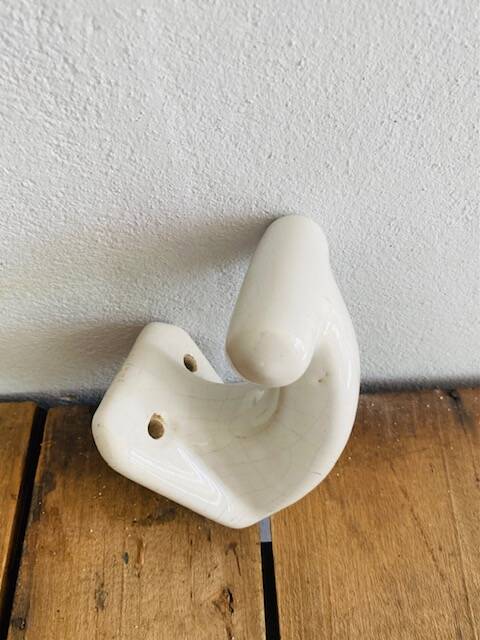 Enamelled earthen coat hook, 1900