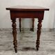 Antique wooden desk with a drawer.