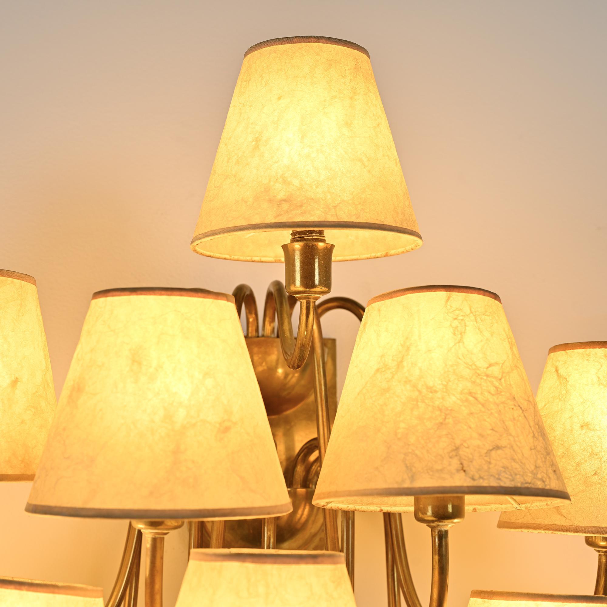 Wall sconce with nine arms in brass, France, circa 1950.