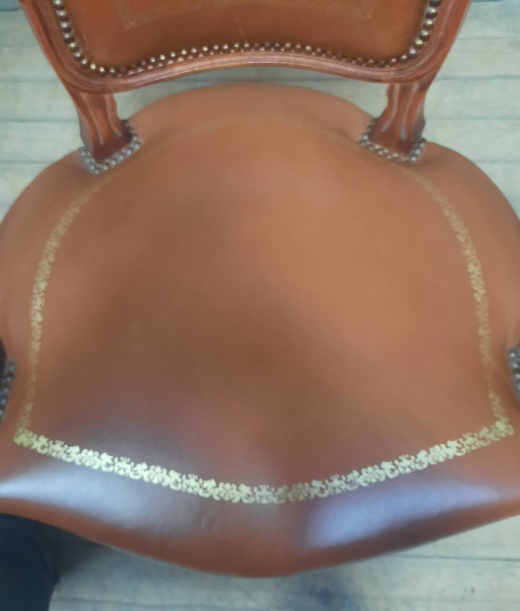 Louis XV style armchair covered in leather.