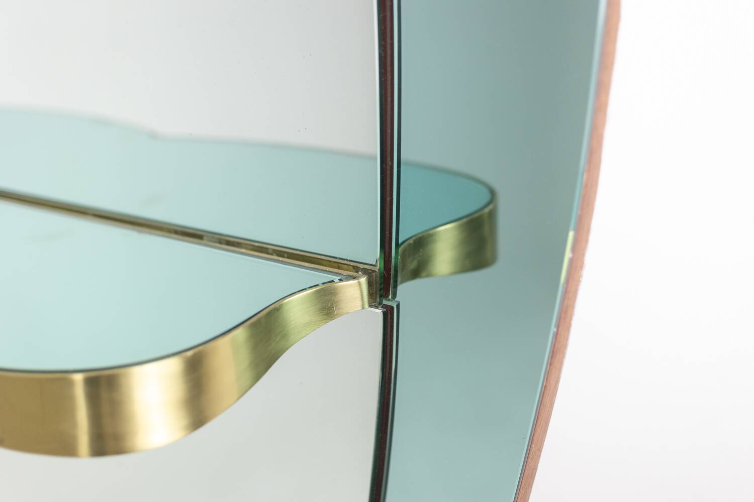Two-tone glass console mirror with gilded brass. Circa 1950.