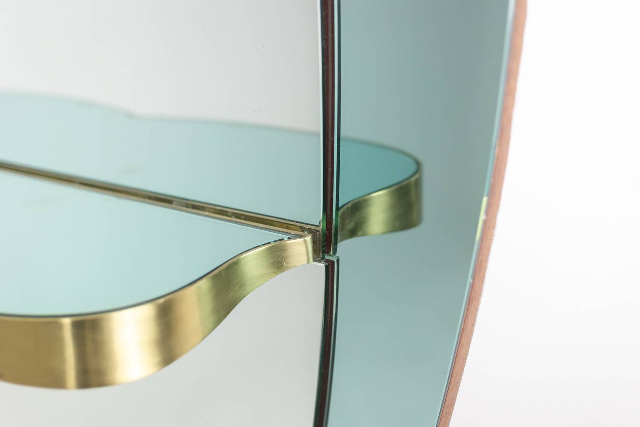 Two-tone glass console mirror with gilded brass. Circa 1950.