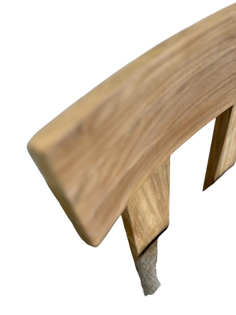 Solid wood chair with a linen-look seat.
