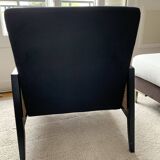 Fauteuil en velours noir et cannage