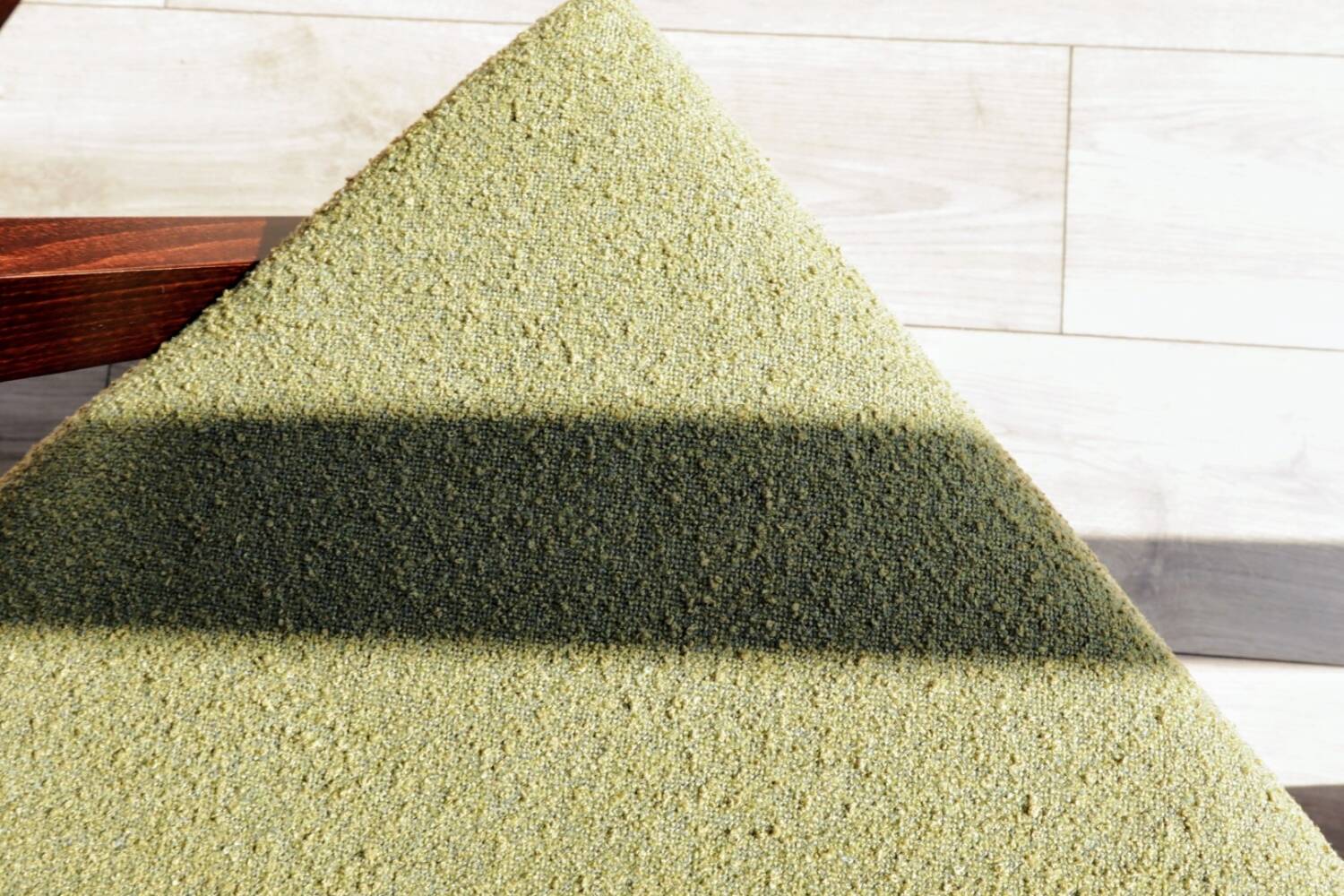 Vintage armchair in moss green bouclé design by H. Lis.