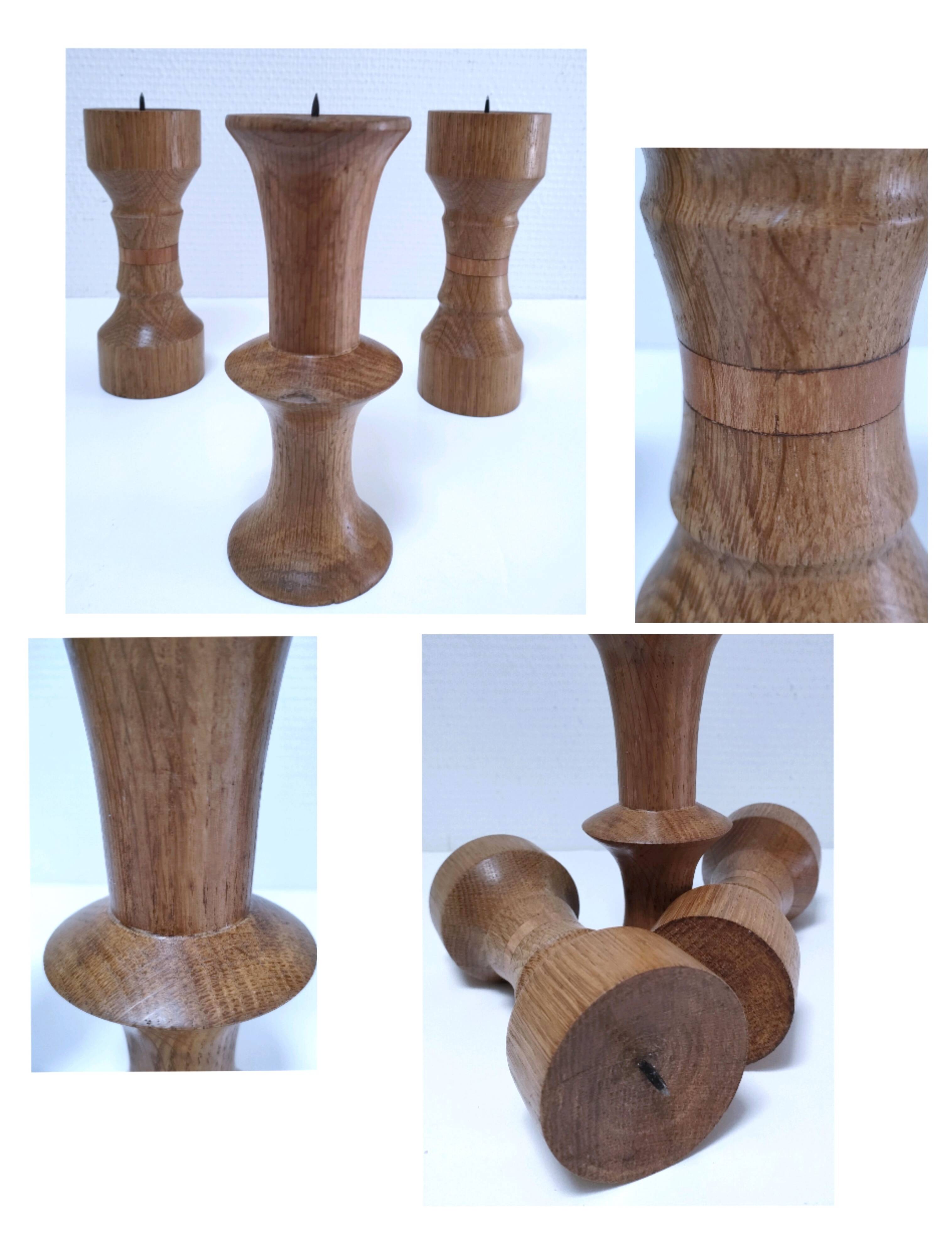Three vintage patinated solid wood candlesticks