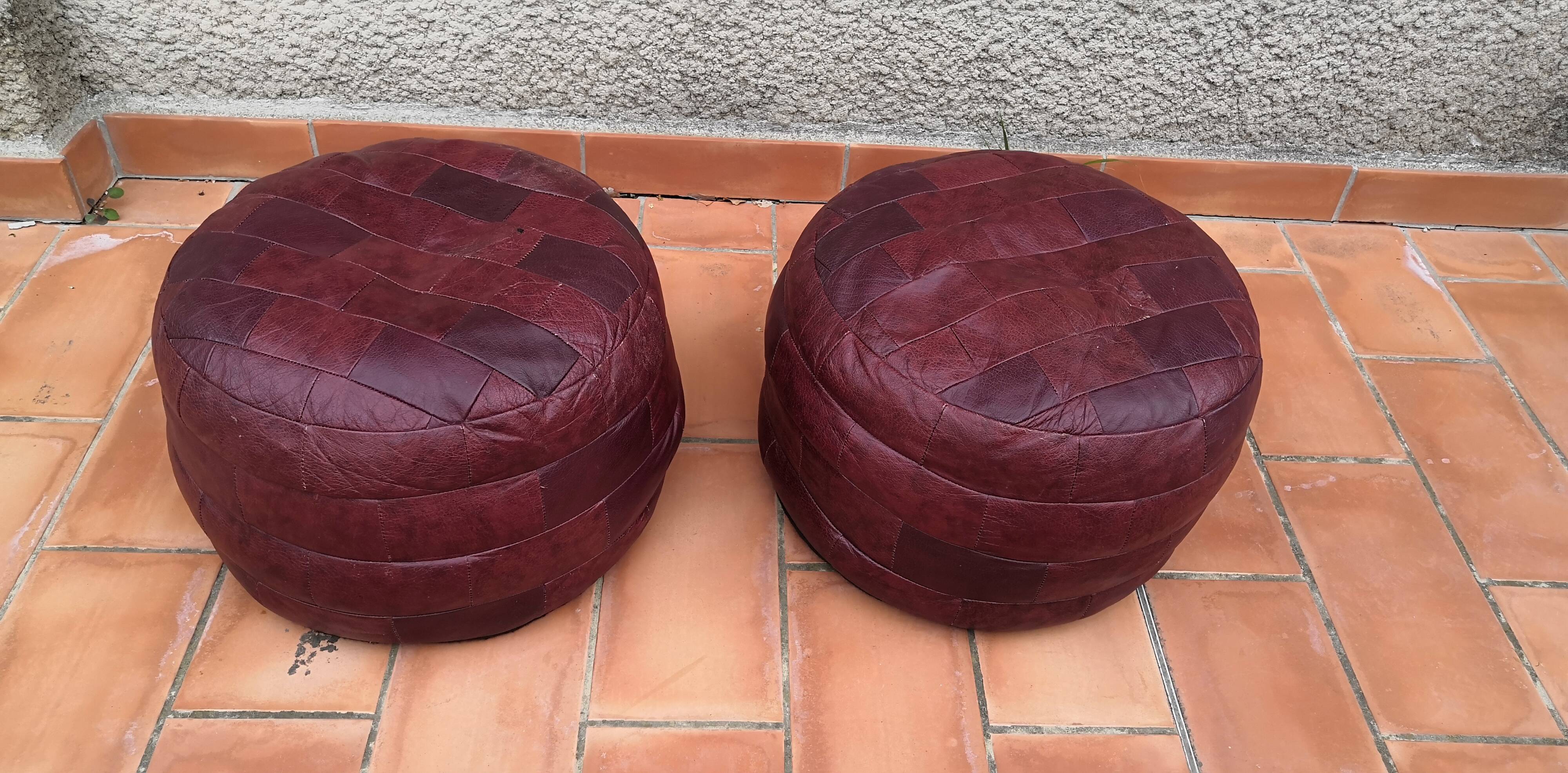 Pair of vintage poufs in burgundy leather patchwork, 1970