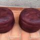 Pair of vintage poufs in burgundy leather patchwork, 1970