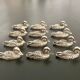 12 metal duck-shaped knife holders